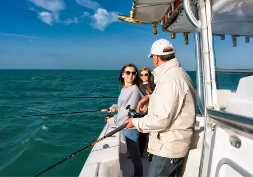 A family enjoys a day on the ocean with Tradewinds Fishing Charters, one of the top Fishing Charters in Anna Maria FL